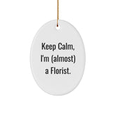 Funny Florist Gifts for Women, Oval Ornament with 'Keep Calm, I'm (almost) A Florist.' Quote, Perfect for Christmas Memorable Presents from Friends to Family - Image 1